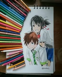 a drawing of two people with colored pencils next to them