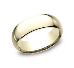 a wedding ring in yellow gold, with a domed surface on the outside and inside