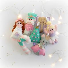 a group of stuffed animals sitting next to each other on a white surface with lights