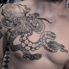 a man with an octopus tattoo on his chest