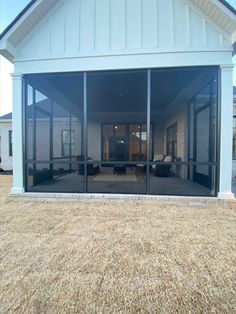 an open patio with sliding glass doors leading into the living room