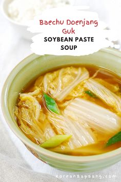 a bowl filled with soup on top of a table