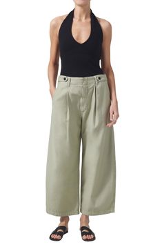 A pleated waist highlights the relaxed, billowy shape of casual-chic twill pants sewn with button tabs for understated utility style. 24 1/2" inseam; 22" leg opening; 13 1/2" front rise; 16 1/2" back rise (size 29) Button fly 100% cotton Machine wash, tumble dry Made in Turkey Cotton Wide Leg Bottoms With Pleated Waist, Cotton Wide Leg Pants With Pleated Waist, Spring Daywear Pants With Patch Pockets, Modern Daywear Bottoms With Pockets, Modern Bottoms With Pockets For Daywear, Wide-leg Khaki Chinos For Workwear, Wide Leg Khaki Chinos For Work, Utility Style Khaki Wide Leg Workwear Pants, Loose Fit Khaki Wide Leg Pants For Work