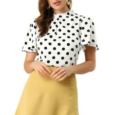 Sweetly spotted and gracefully flared sleeves, this polka dots print top is a charming addition to any look. Simple and delicate, this top features polka dots prints, a stand collar, a keyhole back, and a short flare sleeve. Simple and vintage, this top is a good option for your next workday. Designed to be versatile, this piece is perfect for work, holidays, and everywhere in between. Simply add a skirt or jeans for a chic look. Please check your measurements to make sure the item fits before ordering. The model is wearing size XS. (Height: 5'8.5", Chest: 32 1/3 inches, Waist: 23 3/5 inches, Hip: 35 2/5 inches, Weight: 101.4 lbs) Measurement (in inches) Size-----Chest Girth-----Waist Girth-----Shoulder Width-----Total Length XS----------------35 7/8----------------33 7/8----------------13 Feminine Polka Dot Short Sleeve Blouse, Feminine Short Sleeve Polka Dot Tops, Flare Sleeve Top, Cap Sleeves Blouse, Flared Sleeves Top, Woman Standing, Casual Blouse, Print Top, Work Casual