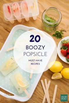 popsicle popsicles with strawberries, lemons and ice cream on a wooden table