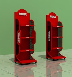 two red bookcases sitting on top of a tiled floor next to each other