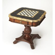 an old wooden table with a chess board on it