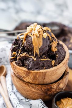 a wooden bowl filled with chocolate ice cream