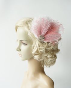 Beautiful Vintage Style, Great Gatsby inspiration designs flapper fascinator. Made of - off white and light pink feather fascinator made turkey feathers ,wispy ostrich plums and peacock feather - rhinestone vintage beaded applique in gold , silver or rose gold Perfect for a Great Gatsby, Downton Abbey, vintage event or a 1920's party ! (gives that look!) Can be worn with feathers on the right or left side of head. The feather fascinator and made on the clip so you decided where and how to place Elegant Pink Ostrich Feather Fascinator, Pink Feather Trim Fascinator For Wedding, Adjustable Pink Feathered Fascinator, Adjustable Pink Feather Fascinator, Pink Adjustable Fascinator With Feathers, Adjustable Pink Fascinator With Feathers, Adjustable Pink Feather Trim Headpieces, Pink Adjustable Feather Trim Headpieces, Elegant Pink Headpiece With Feather Trim