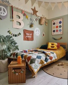 a bedroom decorated in green and yellow with peace signs on the wall