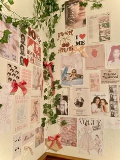 a wall covered in pictures and ivy