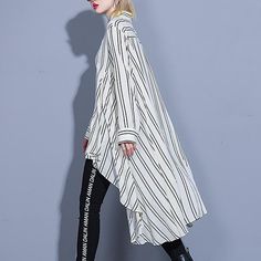 Pattern Type: Blouse Sleeve Type: Long SleeveWaistlines: NaturalElasticity: Slight-stretchyThickness: LightweightMaterial: 51%-70% Cotton-BlendNeckline: Shirt CollarOccasion: Daily, Date timeProcess: Gathered, Asymmetrical, High LowStyle:CasualTheme: SummerLength Front 69 cm / 27.16 "Length Back 108 cm / 42.52 "Sleeve length 57 cm / 22.44 "Cuff: 32 cm / 12.60 "Bust:114 cm/ 44.88 ''Waist: 160 cm/ 62.99 ''Shoulder: 42 cm/ 16.54 '' Trendy Asymmetrical Stretch Blouse, Fitted Asymmetrical Blouse For Daywear, Spring Stretch Blouse With Asymmetrical Hem, Fitted Casual Asymmetrical Shirt, Spring Blouse With Asymmetrical Hem And Stretch, Spring Office Blouse With Asymmetrical Hem, Asymmetrical Hem Blouse For Spring Office Wear, Asymmetrical Hem Blouse For Office In Spring, Chic Oversized Asymmetrical Blouse