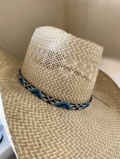 "1/2\" wide All bead work is beaded with 10lb extreme braided nylon line. All hat bands are finished at 23\" with glued than sewed down leather ends and an adjustable leather tie." Western Blue Sun Hat With Flat Brim, Western Style Blue Sun Hat With Flat Brim, Adjustable Woven Straw Hat For Ranch, Handwoven Hat Bands For Rodeo With Flat Brim, Adjustable Straw Hat With Flat Crown For Rodeo, Flat Brim Blue Hats For Ranch, Adjustable Blue Hat For Country Events, Blue Flat Brim Hat For Ranch, Adjustable Flat Crown Straw Hat For Rodeo