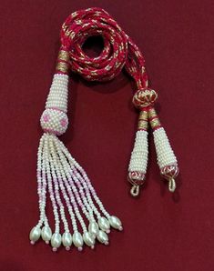 "Adjustable Handmade Necklace Thread, Indian Necklace Jewelry Necklace Cord with Beaded Tassels, Zari Dori Jewelry Supplies.. Bright and beautiful adjustable handmade necklace thread / PINK necklace cord with beaded tassels and brass lobster clasps. All the colors are Available Only on \"Special Requirement of Buyer\"  ON BULK Purchases Special Discount Shall Also be Provided Depending on Size and lot of Orders.. Also all Colorful Threads are Fully Handmade with Silk Thread..   Buyers Might Also See Slight Variations in Color Like Dark or Light.. Due to Picture Quality.. No Compromise on Our Product On Our Side. Looks good with big pendants or chokers can see in the picture. SIZE: 11 inches can go upto 18 inches ( 9 inches each side ). You Will receive one Piece with One Order We do take W Adjustable Tassel Jewelry For Festivals, Adjustable Tassel Jewelry For Festive Occasions, Festival Gift Jewelry With Tassels, Traditional Beaded Necklace With Tassels, White Bohemian Necklaces With Latkans, Traditional Handmade Adjustable Tassel Necklace, Bohemian White Necklaces With Latkans, White Beaded Necklaces With Tassels As Gift, White Beaded Necklaces With Tassels For Gift