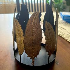 there is a crown made out of leaves on the table