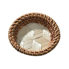 a woven basket is shown on a white background