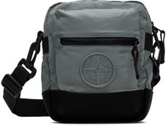 Coated ECONYL® regenerated nylon taffeta and canvas messenger bag in green. · Adjustable and detachable webbing crossbody strap · Zip pocket and embroidered logo at face · Logo-woven webbing strap at back face · Zip closure · Zip pocket at interior · Canvas lining · H8 x W6.5 x D2 Supplier color: Grey green Supplier code: 811590876 Designer Shoulder Bag With Embroidered Logo For Travel, Designer Bags With Logo Patch For Everyday Use, Travel Shoulder Bag With Embroidered Logo, Travel Crossbody Shoulder Bag With Logo Patch, Travel Crossbody Bag With Embroidered Logo, Nylon Bag With Embroidered Logo For Everyday Use, Everyday Nylon Bags With Embroidered Logo, Travel Crossbody Shoulder Bag With Embroidered Logo, Casual Shoulder Bag With Logo Patch For Travel