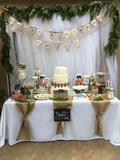 a table topped with lots of cake and desserts