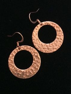 Lightweight Hammered copper hoop dangle earrings.Looking for something lightweight, bright and natural? This simple yet elegant pair of hammered copper earrings will definitely catch the light!These earrings are solid high-quality copper. One side is hammered, the other side of smooth. These earrings are 1 inch in diameter. They are very light weight, only 2 g. French ear wires are also solid copper.All my jewelry comes gift boxed with a custom Shelly Mariposa Design butterfly card ready for gif Hammered Rose Gold Copper Jewelry, Hammered Copper Round Hoop Earrings, Hammered Copper Drop Earrings, Hammered Copper Hoop Jewelry, Hand Forged Copper Hoop Earrings With Dangle, Hand Forged Copper Dangle Hoop Earrings, Nickel-free Copper Hoop Earrings, Rose Gold Hammered Metal Earrings, Rose Gold Copper Drop Earrings