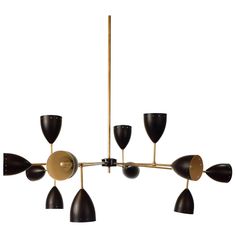 a black and gold chandelier with five lights hanging from it's sides