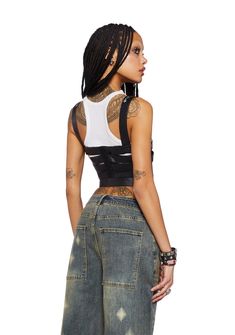 cuz you pay them no mind. This strappy harness style crop top has a vegan leather construction with a cut-out design, floral embroidery, adjustable buckle straps on the front and shoulders, and hook-eye closures on the back. Edgy Corset Belt For Alternative Fashion, Edgy Fitted Harness For Alternative Fashion, Punk Style Harness For Night Out, Edgy Fitted Harness With Suspenders, Edgy Corset For Concert, Edgy Corset For Alternative Fashion In Summer, Adjustable Straps Fitted Harness, Spring Underbust Crop Top With Straps, Black Corset Belt With Adjustable Straps