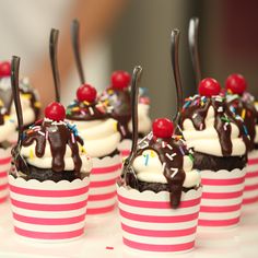 cupcakes with chocolate frosting and cherries on top