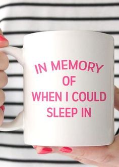 a woman holding a coffee mug with the words in memory of when i could sleep in