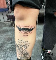 a person with tattoos on their legs