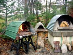 an outdoor oven in the woods with fire coming out