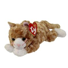 a small stuffed cat laying down with a heart on it's chest and eyes closed