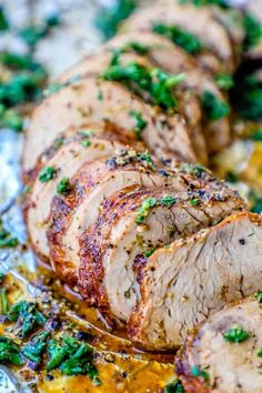 sliced pork roast with herbs on top