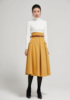 "The yellow wool skirt made with soft wool blend, it has a polyester lining inner. It is high waist skirt for winter day, The knee length skirt has two up-entry pockets. Back zipper made the skirt easy to wear. Details: * 30% wool, 30% fiber, 40% polyester * fully satiny liner * back zipper closure * two side pockets * High waisted pleated skirt * knee length effect * Dry clean CUSTOM MADE SERVICE If you * Need a tailored clothes with your body measurement * Need a Better fit * Can't find your s Pleated Skirts Knee Length, Skirt For Winter, Long Wool Skirt, Librarian Style, Skirt Winter, Knee Skirt, Tailored Clothes, Wool Winter Coat, High Waisted Pleated Skirt