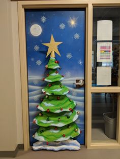 a decorated door with a christmas tree on it