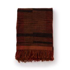 a brown and black blanket with fringes on the bottom, against a white background