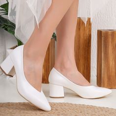 Welcome to Belle Wedding Shoes, your destination for exquisite White Bridal Block Heels that effortlessly blend style and comfort. * These low-block heels, boasting a 2-inch (5 cm) heel height, strike the perfect balance between grace and ease, making them ideal wedding shoes. * Crafted from premium white vegan leather, our White Bridal Stilettos offer both style and comfort. Meticulously handmade by skilled artisans, each pair reflects a dedication to craftsmanship and attention to detail. * Own your moment with these exceptional low-block heel stilettos that encapsulate luxury, style, and craftsmanship. Shop our collection of bridal sandals today and experience the Belle Wedding Shoes difference! Model: White Wedding Stilettos Heel Height: 2.1 inches / 5.5 cm Product Type: Handcrafted Co White Low Block Heels Wedding, Bridal Stilettos, Shoes White Heels, Classic Wedding Shoes, White Court Shoes, Heels Low Heel, Low Pumps, Boho Wedding Shoes, Unique Wedding Shoes