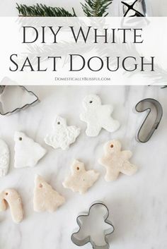 white salt dough with christmas decorations and cookie cutters