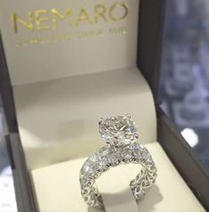 a diamond ring in a box with the name nemaro on it's side