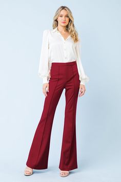 The DEPTHS OF BEAUTY FLARE PANTS combine sleek modern style with timeless sophistication. Crafted from a stretchy yet supportive blend of fabrics, the pants feature a high-rise waist and wide-leg fit, as well as front zipper/hook & eye closure, center seam, and faux back pockets. You'll look and feel stylish and confident all day long. Details Self: 97% Polyester 3% Spandex Size & Fit - Model is 5`8" And Wearing Size Small - Measurements Taken From Size Small - Approx. Length: 45" Elegant Stretch Flares, Sleek Flare Pants For Fall, Fitted Wide Leg Pants For Date Night In Fall, Elegant High Waist Wide Leg Elastane Pants, Elegant Stretch Flares For Spring, Elegant Party Flares, Elegant Fall Flares Trousers, Elegant Flares For Fall, Chic Stretch Flare Trousers