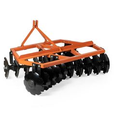 an orange and black tractor with wheels on a white background is seen in this image