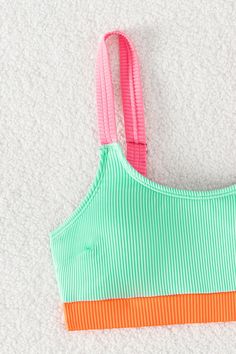 Get ready to stand out in the sun with our Rib Neon Colorblock Scoop Neck Top & Hipster Bikini Set! The bright and bold colors will have you feeling confident and vibrant all day long. The ribbed texture and scoop neck top add a touch of retro flair, while the hipster bikini bottoms provide the perfect balance of comfort and style. Soak up the sun and enjoy the beach in this playful and trendy set! Product code: CAA12C3H077PP Features:  Scoop neck Removable cups Medium bust support Wide stra Playful Green Swimwear For Pool, Vibrant Green Swimwear For Poolside, Playful Green Pool Swimwear, Sporty Tankini For Beach In Spring, Playful Green Tankini For Summer, Vibrant Green Swimwear For Sunbathing, Summer Striped Color Block Swimwear, Neon Swimwear For Summer Poolside, Trendy Multicolor Tankini For Vacation