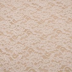 a white lace fabric with flowers on it