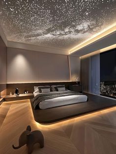 a large bed sitting in the middle of a bedroom under a sky filled with stars