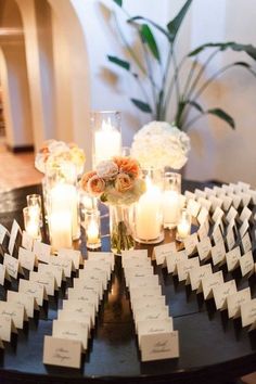 a table with candles and place cards on it