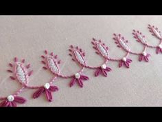 pink and white crocheted flowers with pearls