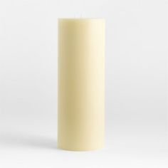 a tall white candle is shown against a white background