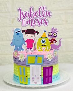 a birthday cake with monsters on it and the words jabella imeses