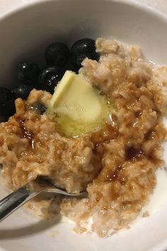 oatmeal with blueberries and butter in a bowl