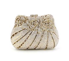 Description: The BELLA Rose Clutch is an elegant statement accessory. Crafted with beautiful gold crystal, this chic clutch is sophisticated and luxurious. Perfect for any evening occasion, this clutch will add an elevated touch to your look. Lining Material: Synthetic Leather Detachable Chain Included Approximate Size: 17-1/2cm (L) x 5cm (W) x 10cm (H) Handmade Clutch Purse, Clear Tote Bags, Rhinestone Clutch, Handmade Clutch, Crystal Clutch, Wedding Purse, Wedding Clutch, Bridal Clutch, Vintage Purses