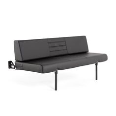 a black couch sitting on top of a metal frame with two arms and one arm extended