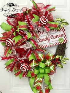 a christmas wreath with candy canes on it